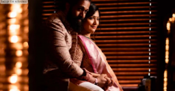 As they take a picture while dressed in traditional clothing, Yash and Radhika Pandit are absorbed in one another's presence